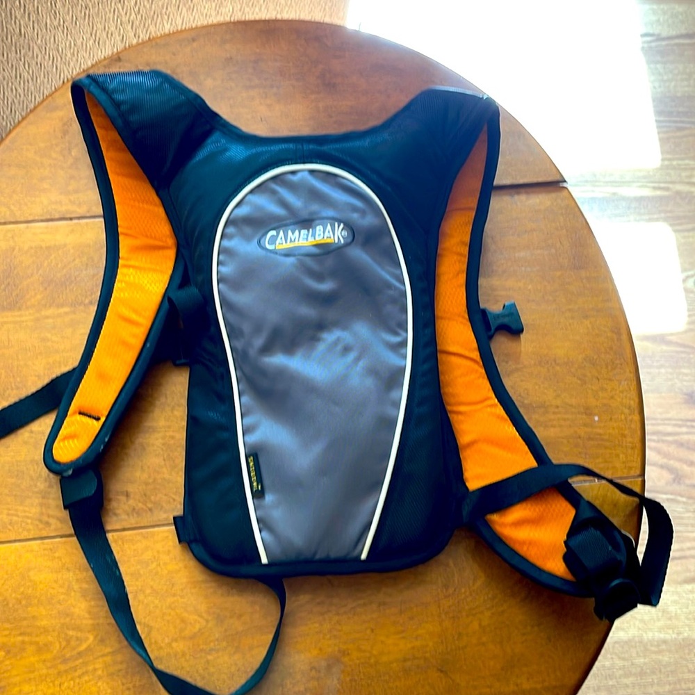 Like new Camelbak Snobowl backpack. 1.5liters/50oz. Orange/grey/black